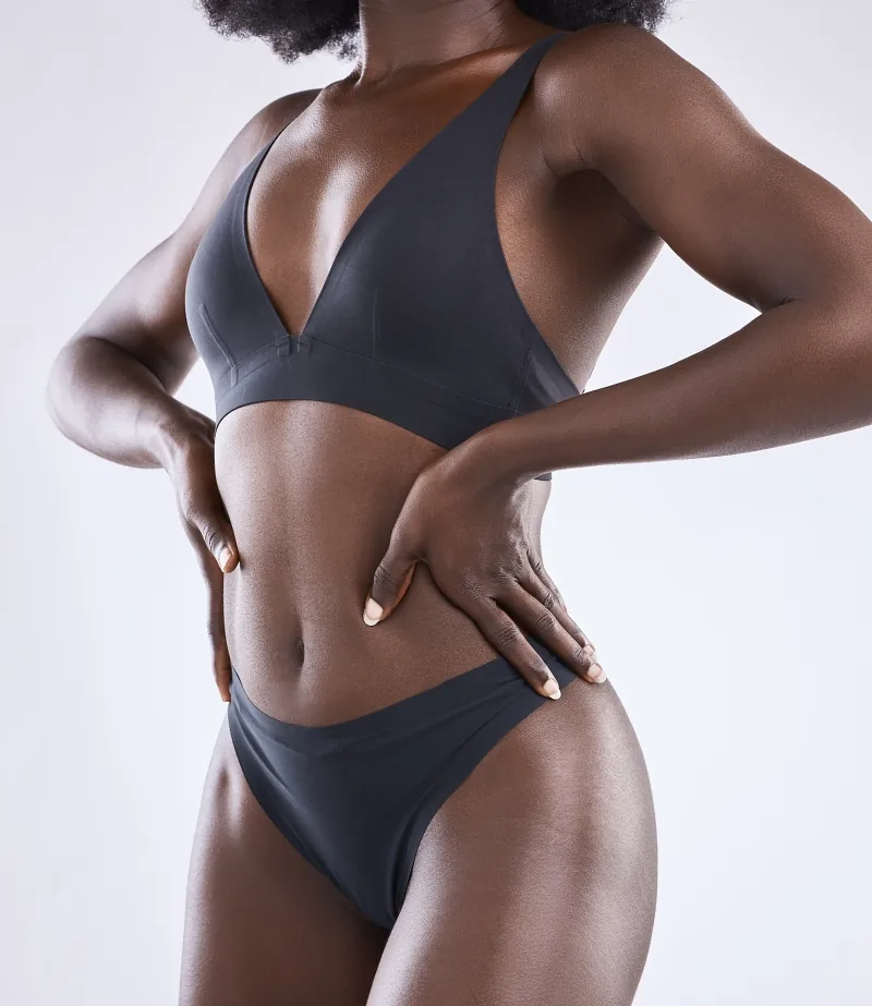 Woman with flat, toned abdomen after tummy tuck surgery with Dr. Luckey in Franklin, TN